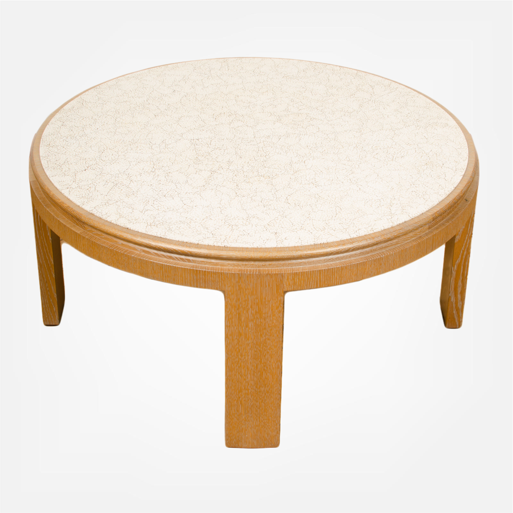 Modernist round cocktail table with eggshell fragment surface.