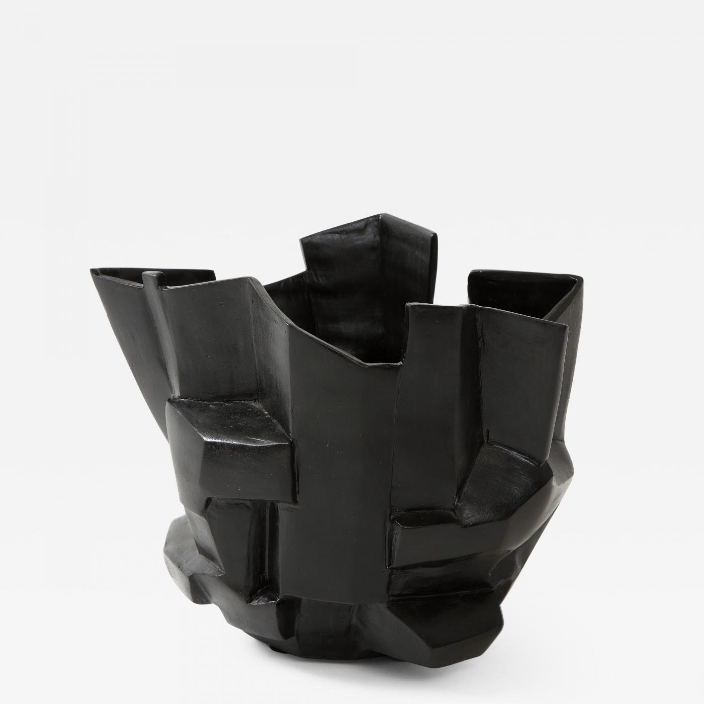 An R.A Pesce wheel-thrown cubist vessel in white stoneware with black glaze.