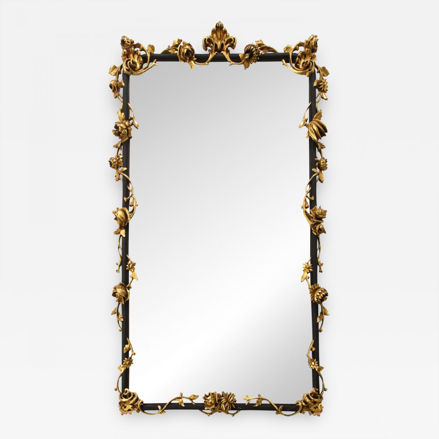 An Italian Rococo style giltwood and black painted wall mirror