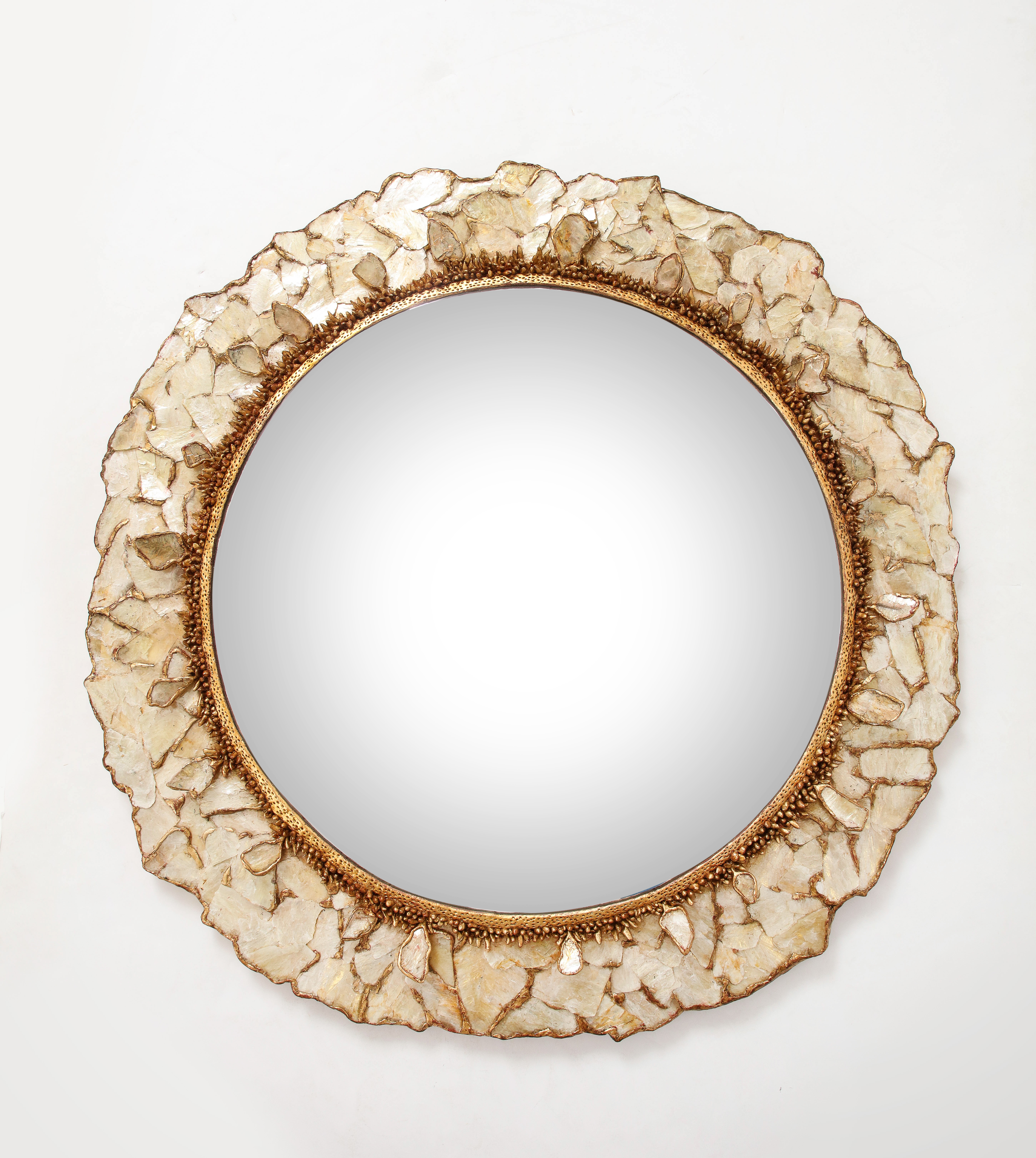 An unique artist mirror. Made of Mica and gilded resin