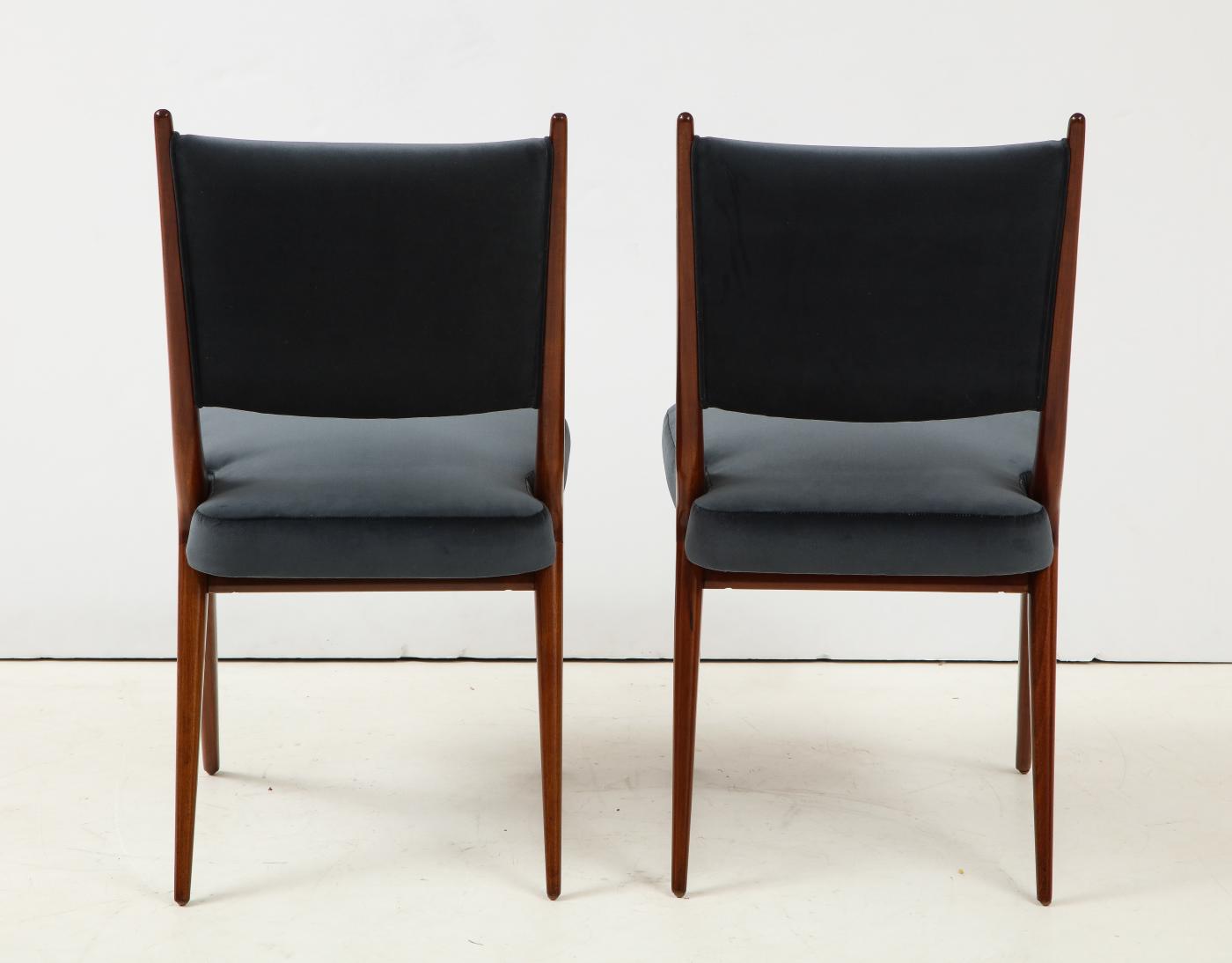 A set of Six mid century modern dining chairs. Solid Italian Walnut.