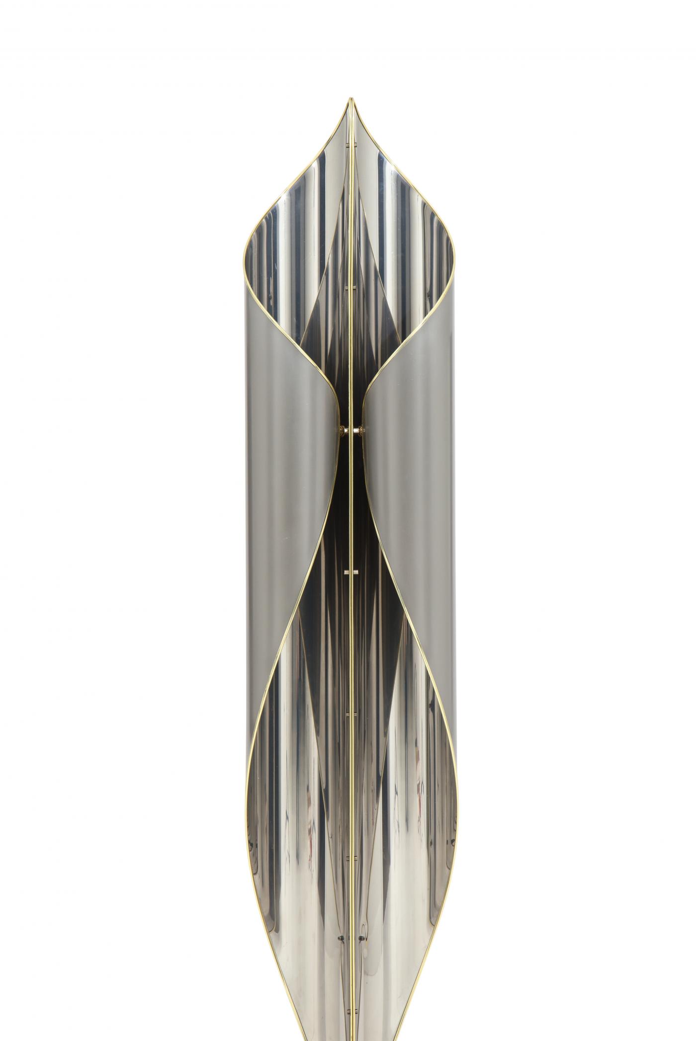 Floor lamp in chrome and steel combined with Brass details.