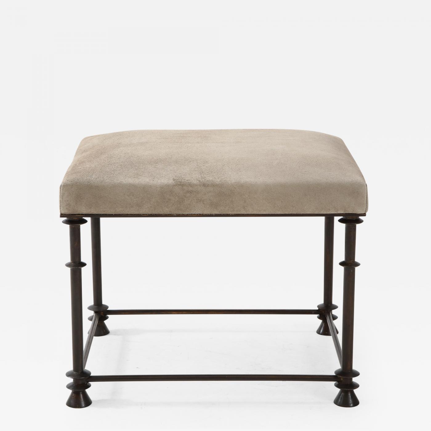 An elegant bronze stool covered with 