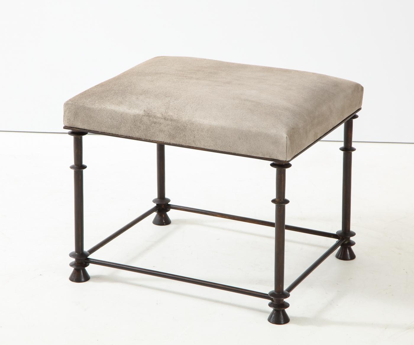An elegant bronze stool covered with 