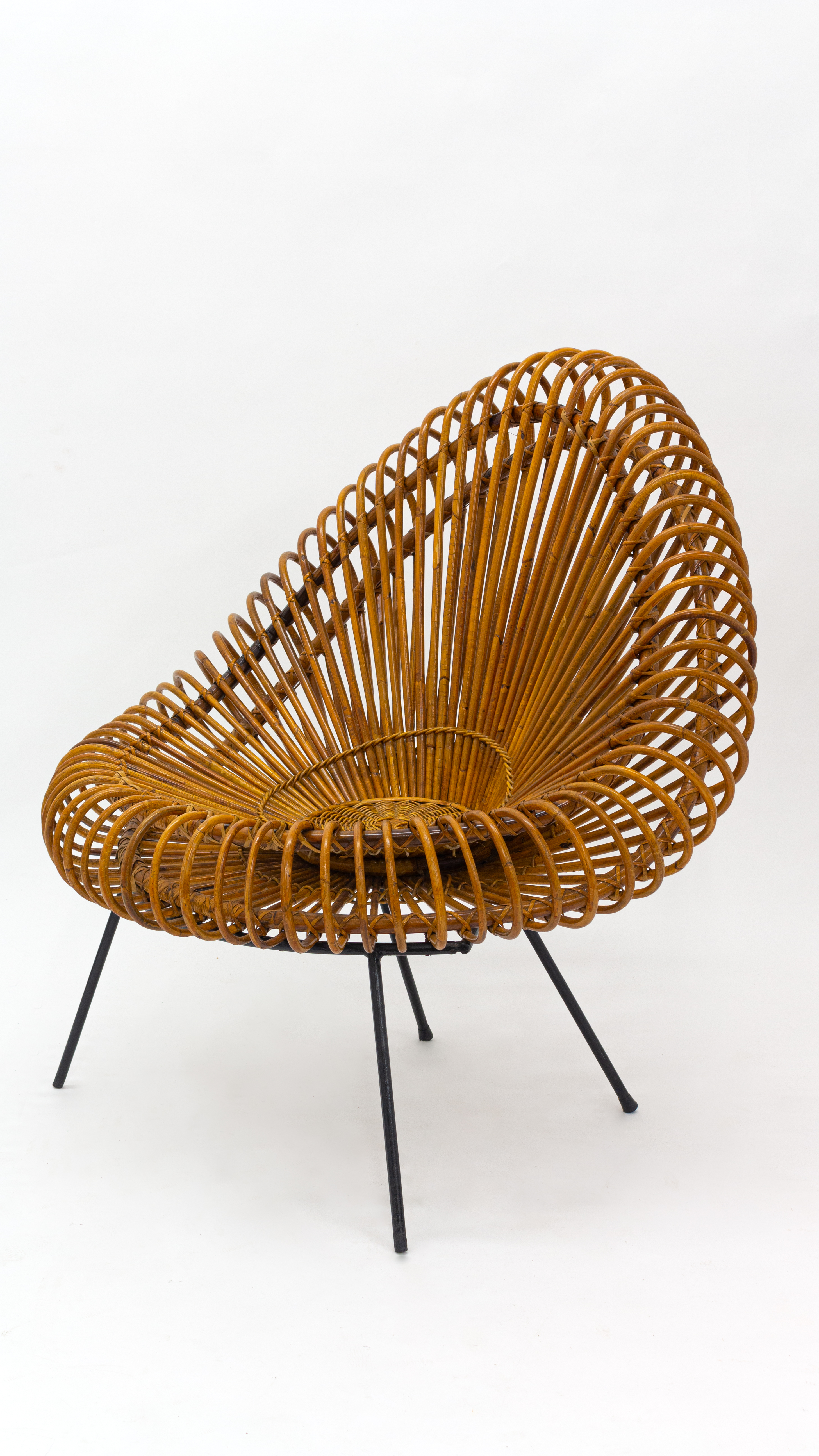 A stylish rattan and iron chair designed by Janine Abraham.
