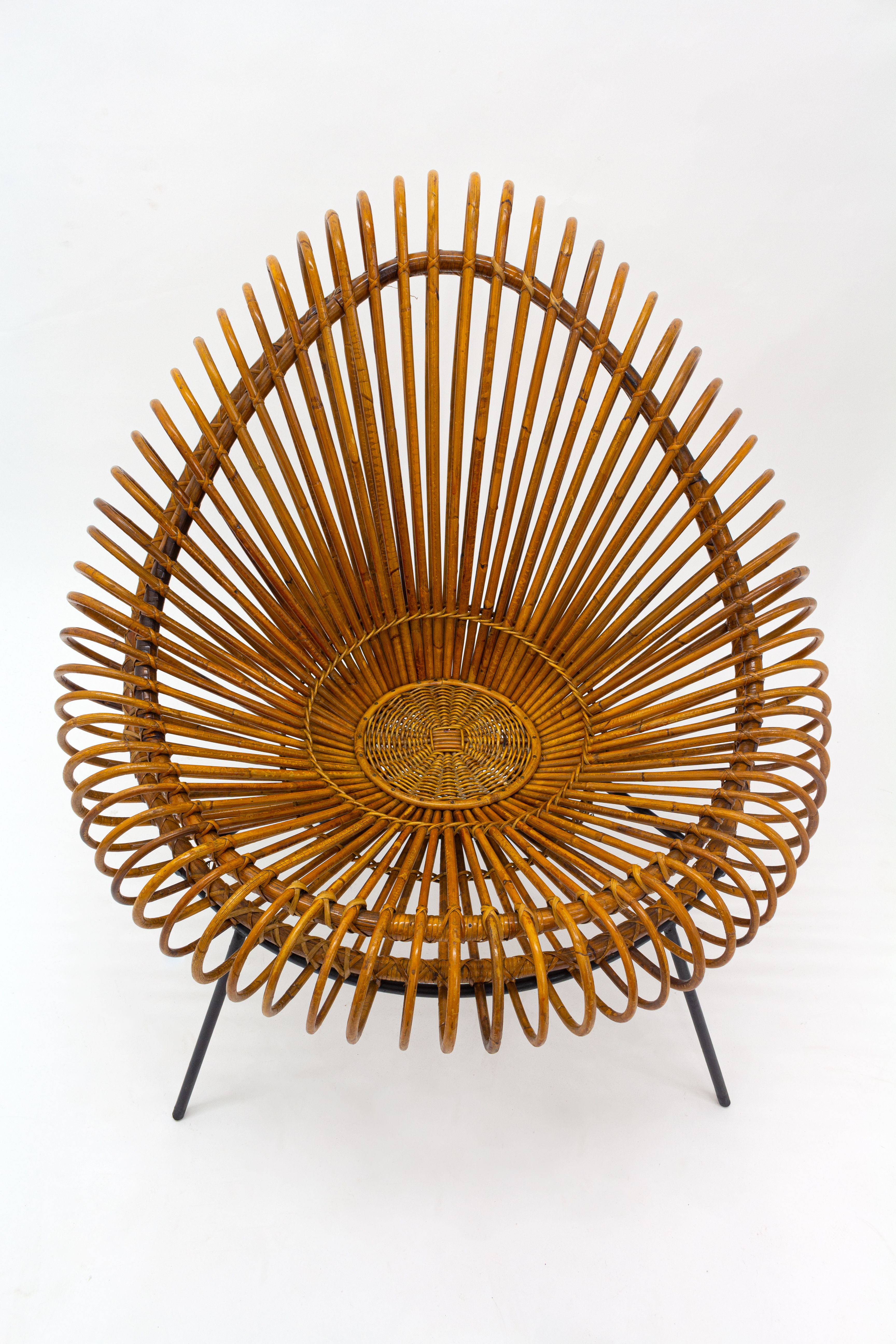 A stylish rattan and iron chair designed by Janine Abraham.