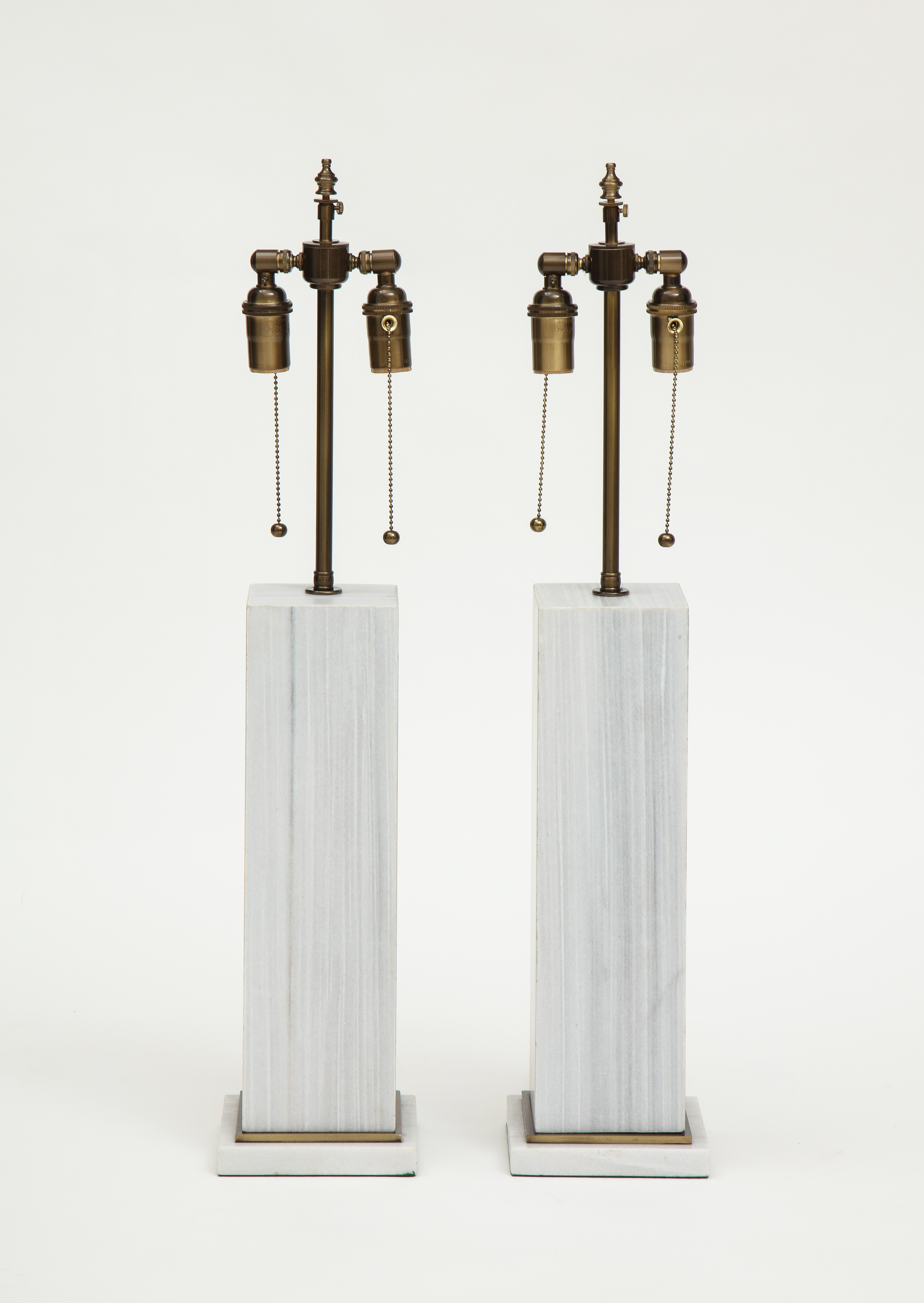 A pair of column shaped lamps