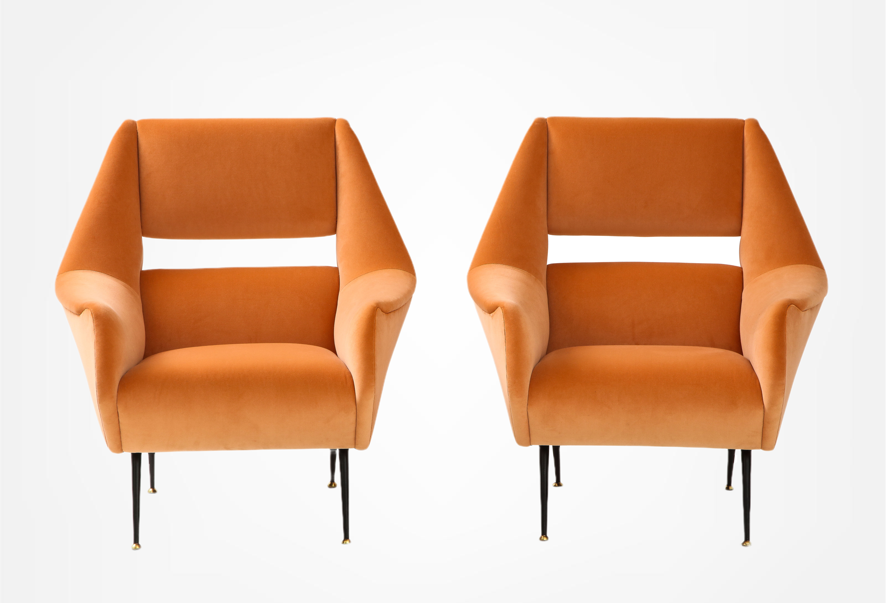  A pair of Gigi Radice upholstered club chairs on iron legs
