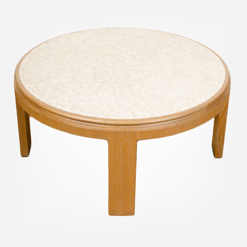 Modernist round cocktail table with eggshell fragment surface.