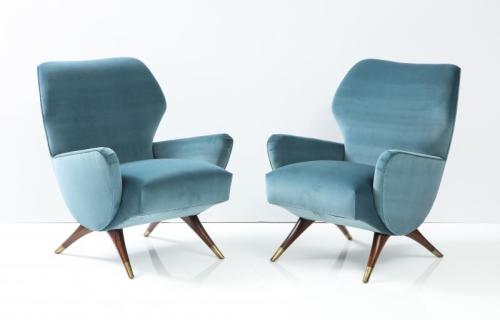 Mid Century Style Armchairs. Walnut and brass sabots.