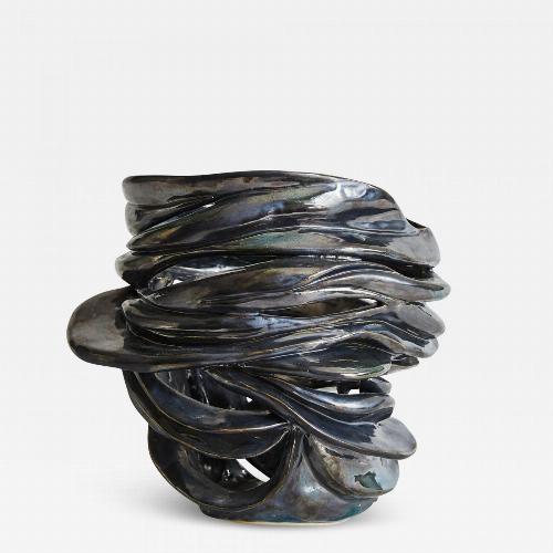 Hand-carved biomorphic vessel in white stoneware with a steel glaze. Signed: RP.