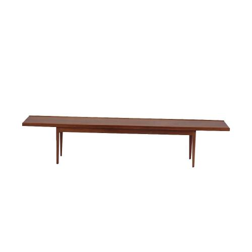 A Modernist Kipp Steward bench table in walnut, circa 1950.