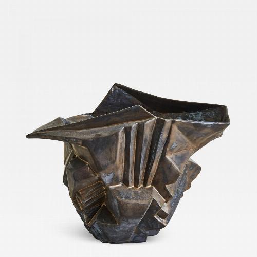 Wheel-thrown and manipulated cubist vessel in white stoneware.