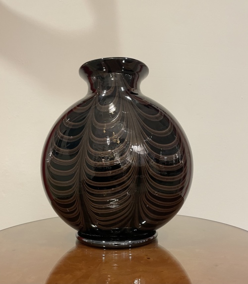 Large black glass vase with gold inclusion design.