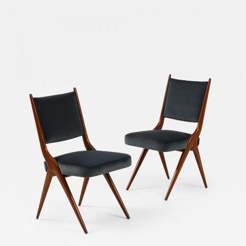 A set of Six mid century modern dining chairs. Solid Italian Walnut.