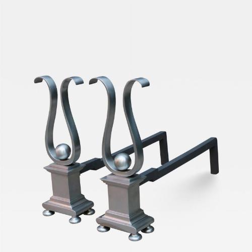 A pair of Architectural Andirons, Patinated metal