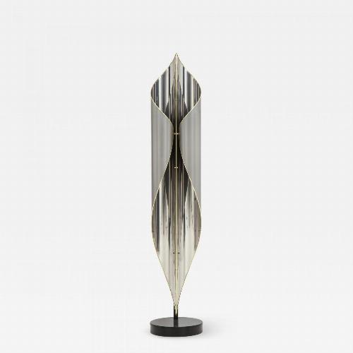 Floor lamp in chrome and steel combined with Brass details.