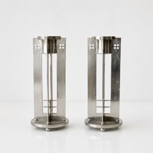 A pair of Silver Plate Swid Powell Candlesticks