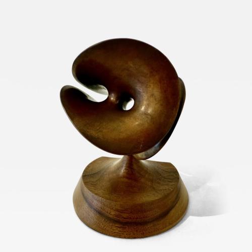Abstract Bronze sculpture with a patinated copper finish.