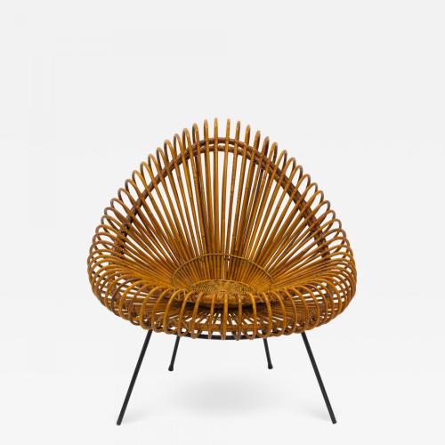 A stylish rattan and iron chair designed by Janine Abraham.