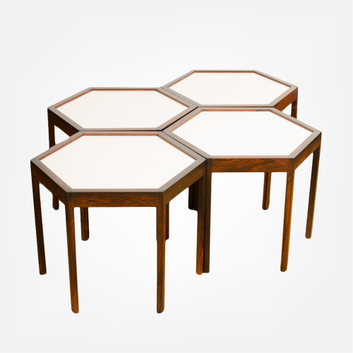 A set of four Danish side tables designed by Hans C Andersen. Hexagon shape with solid rosewood and white laminate top circa 1960. 