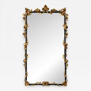 An Italian Rococo style giltwood and black painted wall mirror